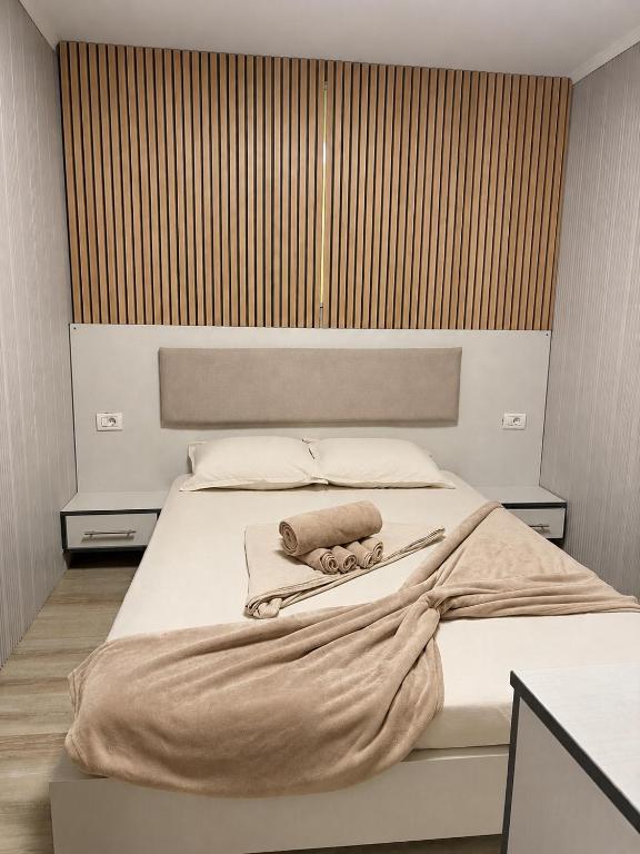 a bedroom with a bed with a towel on it at NeverseaBlack Sea in Constanţa
