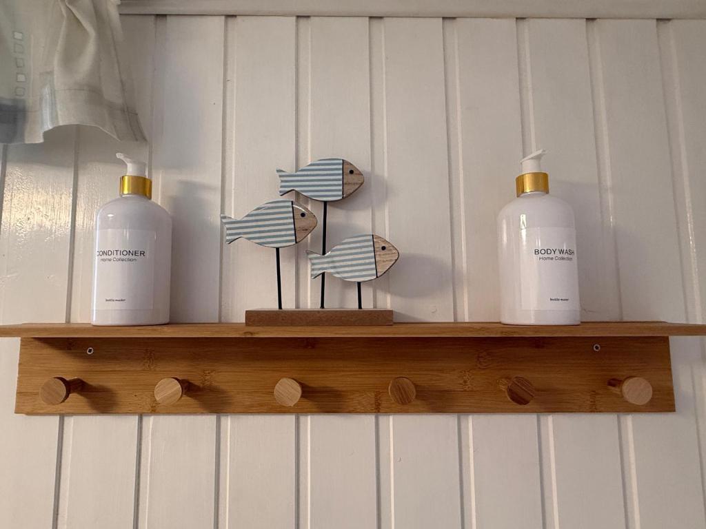 a shelf with three bottles on top of it at Ferienhaus Weitblick in Oberthal