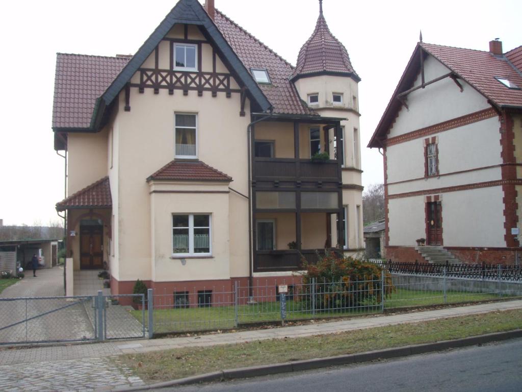 a large house with a fence in front of it at Villa Mary in Lychen