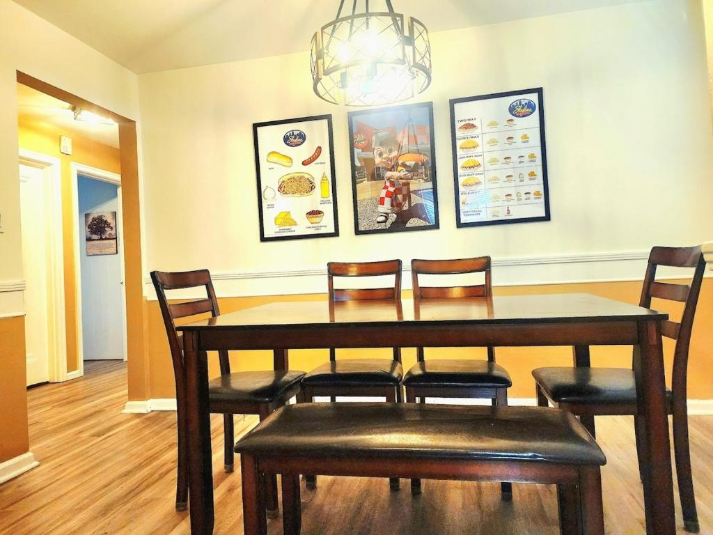 a dining room with a wooden table and chairs at 513Company - Hometown +Location in Cincinnati