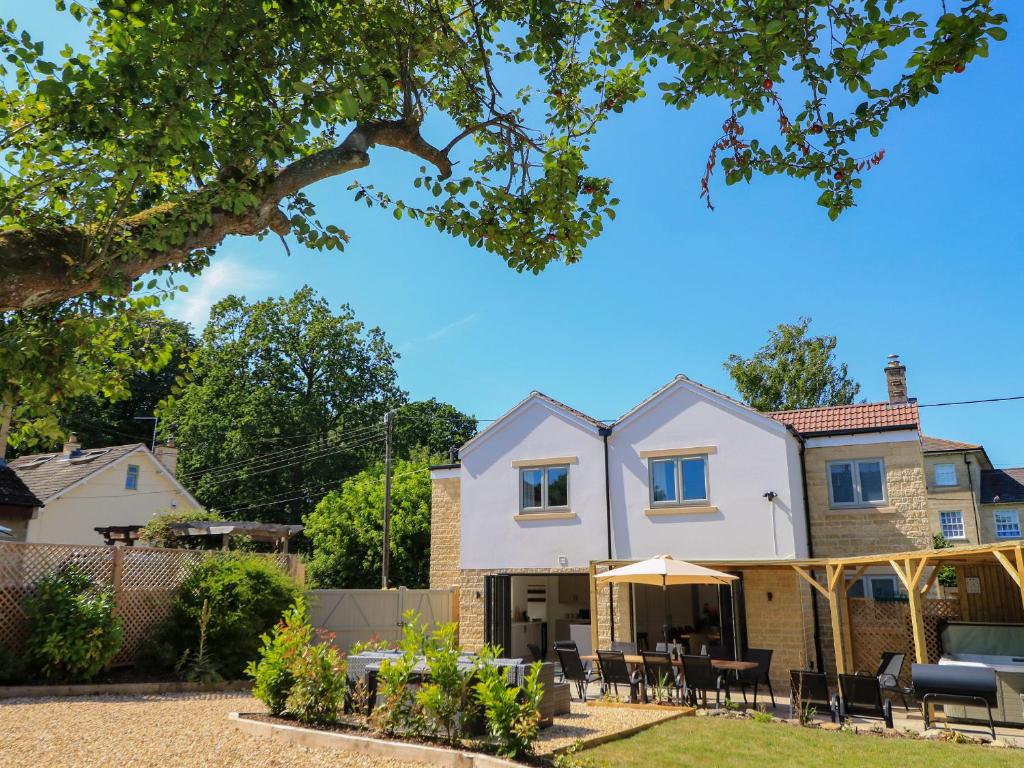 a house with a patio in front of it at Cern-Wyn in Chippenham