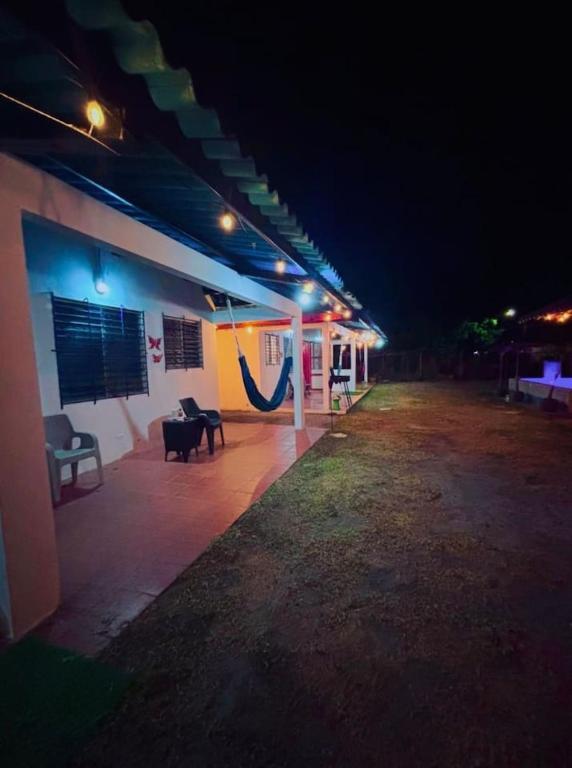 a lit up building with a patio at night at Beachside Cabana with Pool & Beach Access in Nueva Gorgona