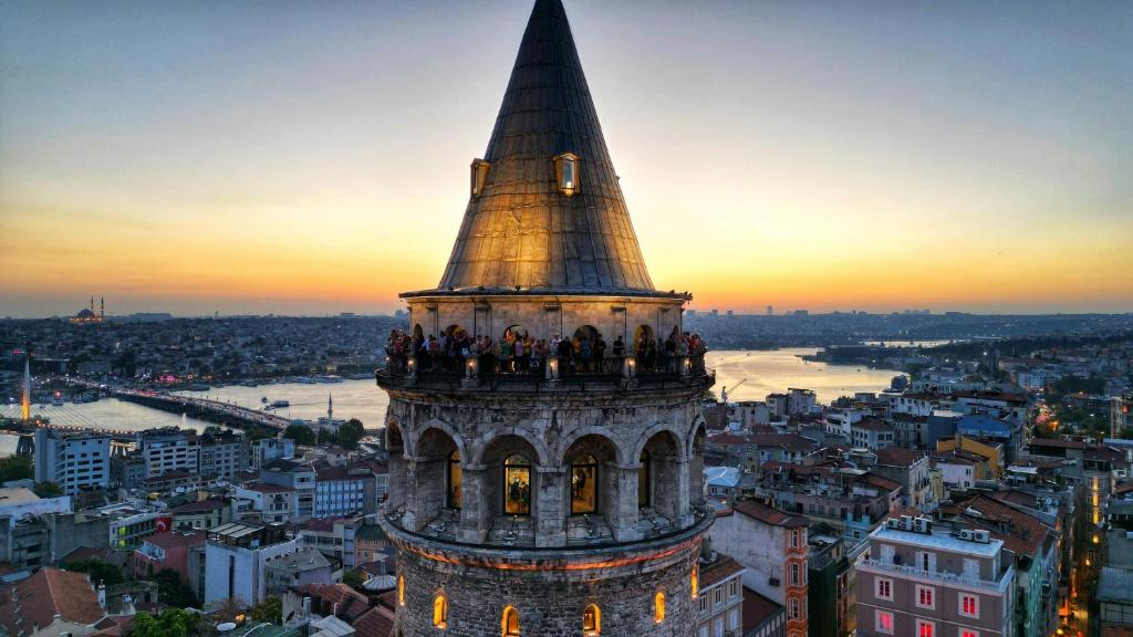 a group of people standing on the top of a tower at Hotel Gritti Pera & Spa in Istanbul