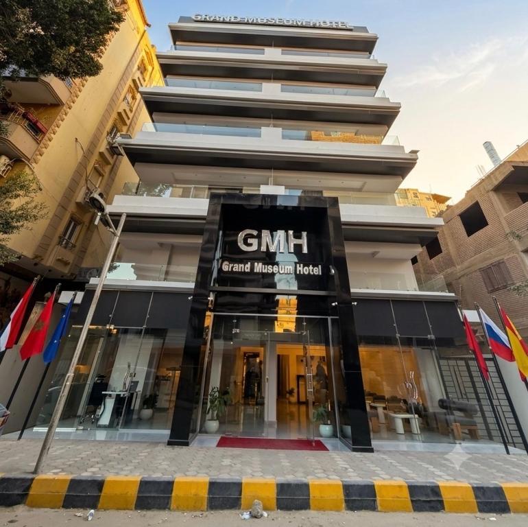 a building with a sign that reads ghm central mumbai hospital at Grand Museum Pyramids in Cairo