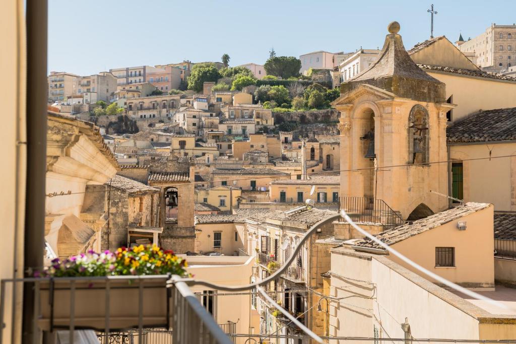 a view of the city from the balcony of a building at A un Passo dal Centro in Modica
