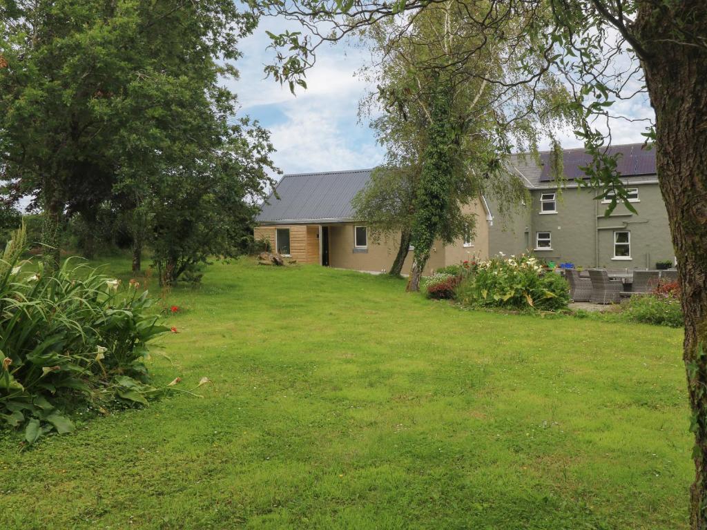 a house with a yard in front of it at Mayfly Cottage in Clonbur