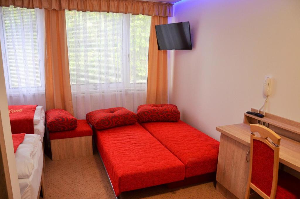 Postel nebo postele na pokoji v ubytování Hotelový resort Šikland
