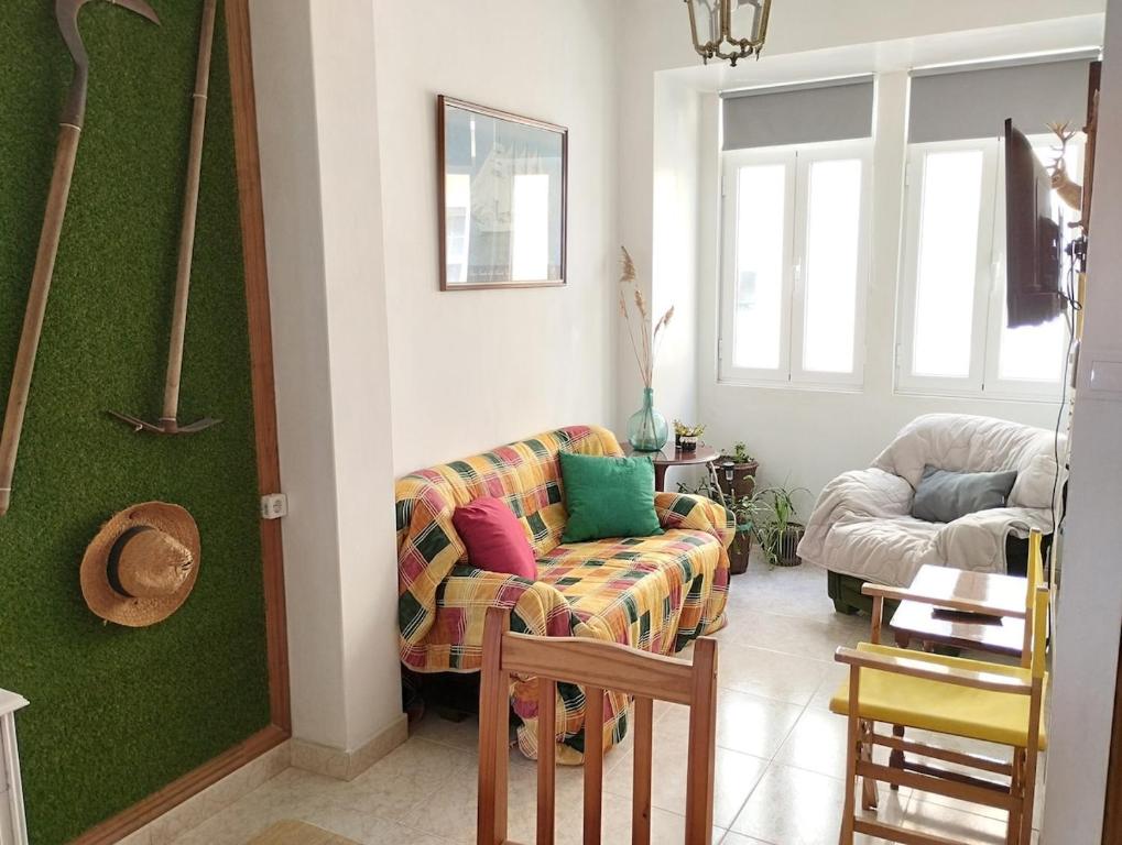 a living room with a couch and a chair at Eco Mar - Cedeira in Cedeira
