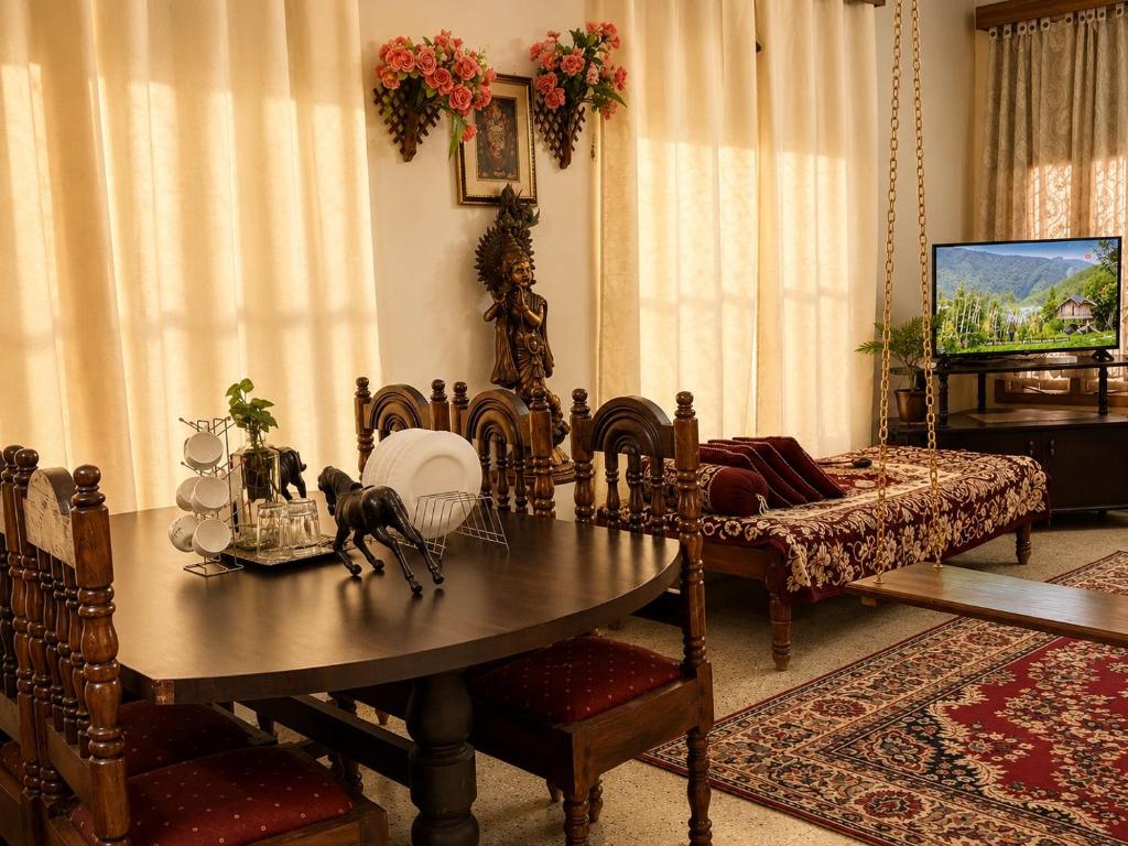 a living room with a table and a couch at The Timeless Mysuru bungalow in Mysore