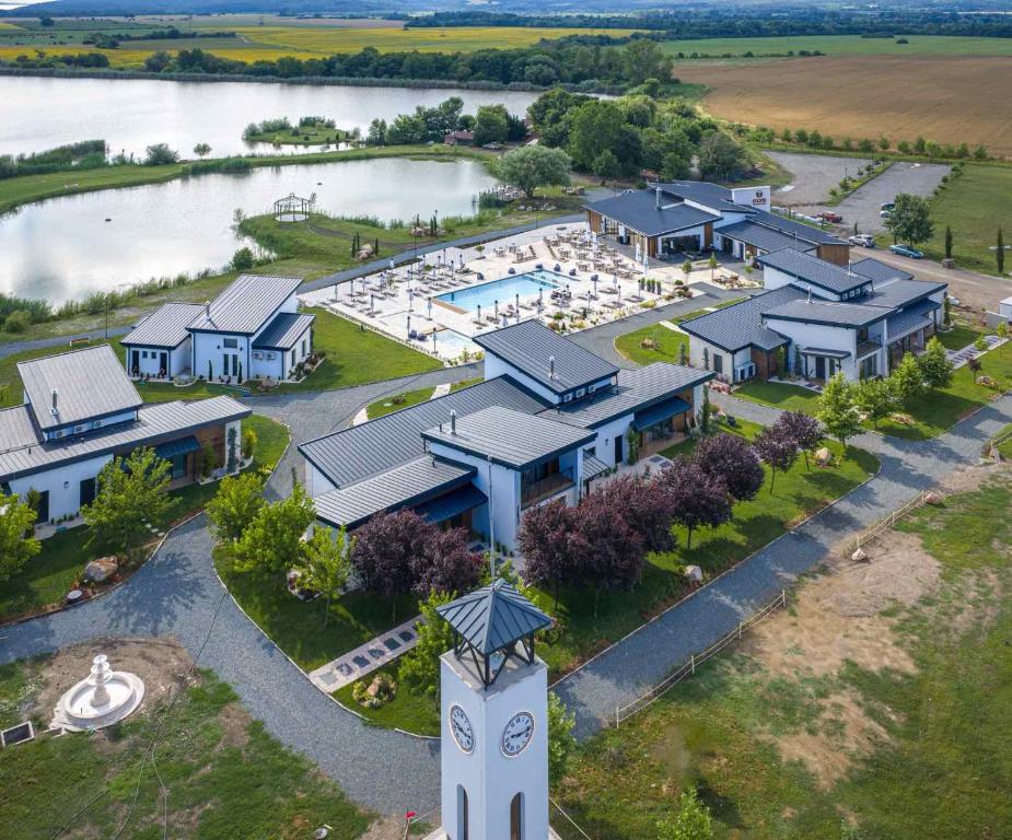 an aerial view of a resort with a clock tower at Maria village resort in Pavel Banya
