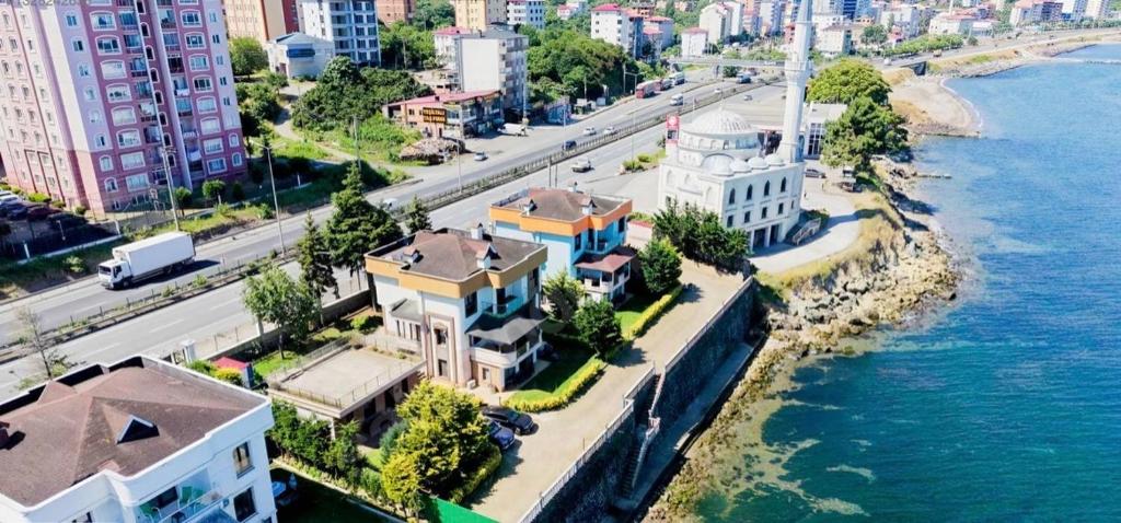an aerial view of a city next to the water at Seyran Seaside Apartments - 2-dublex in Trabzon