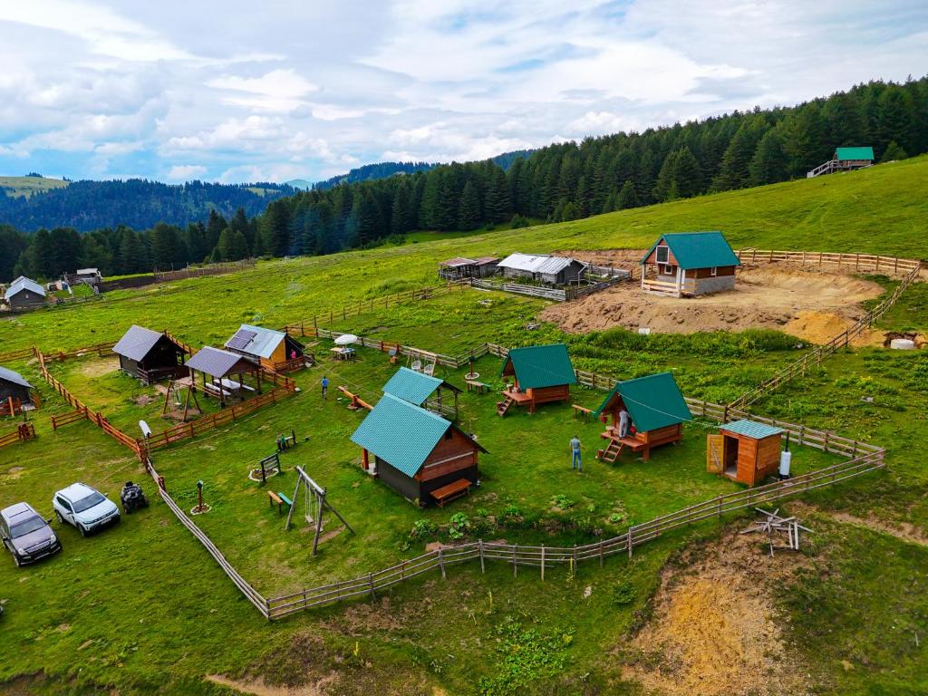an aerial view of a farm with houses on a hill at Eko Kamp Garcevic in Plav