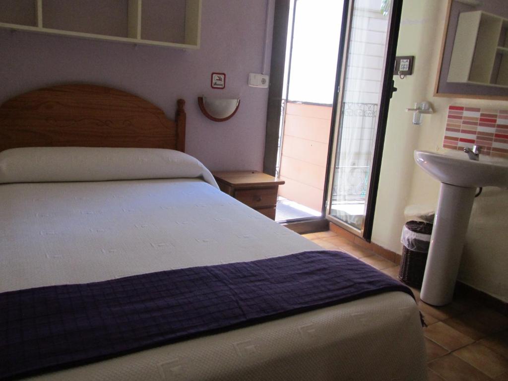 Postel nebo postele na pokoji v ubytování Pension Alamar