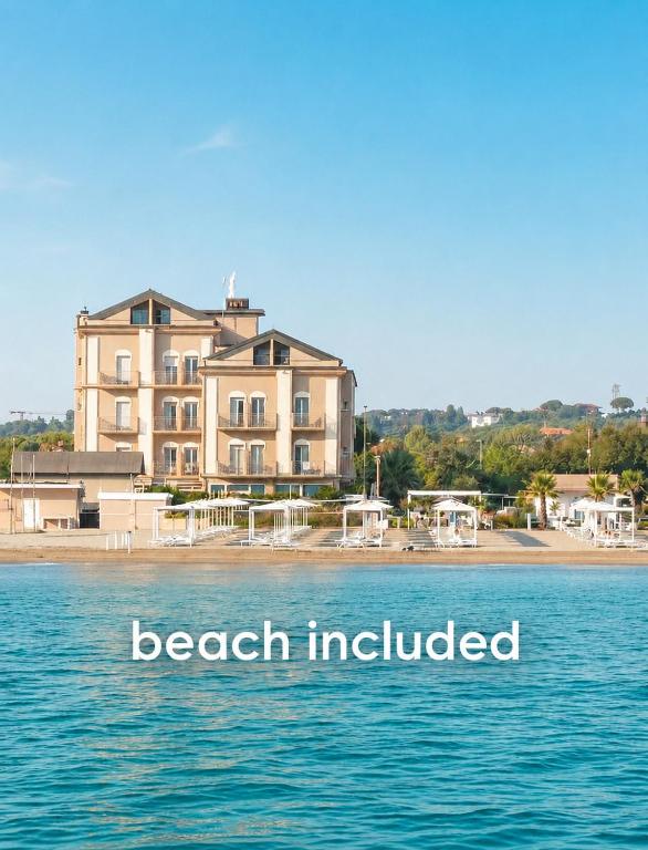 a large building on a beach with the words beach included at Hotel Liberty Beach - Parking & Beach in Riccione