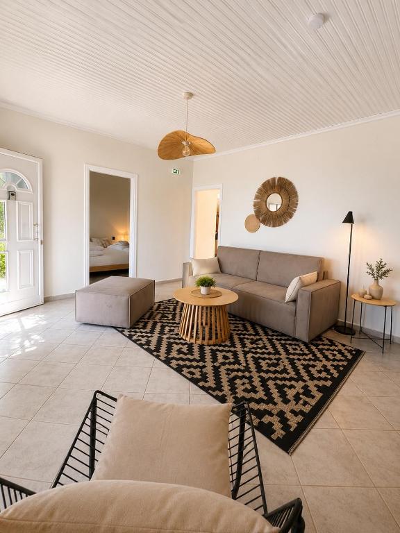 a living room with a couch and a table at THEONprivehouse in Koinyra