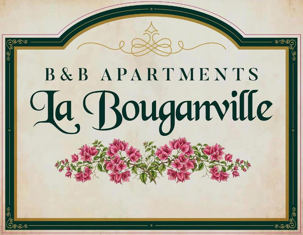 a sign for a restaurant with flowers on it at La Bouganville in Arco