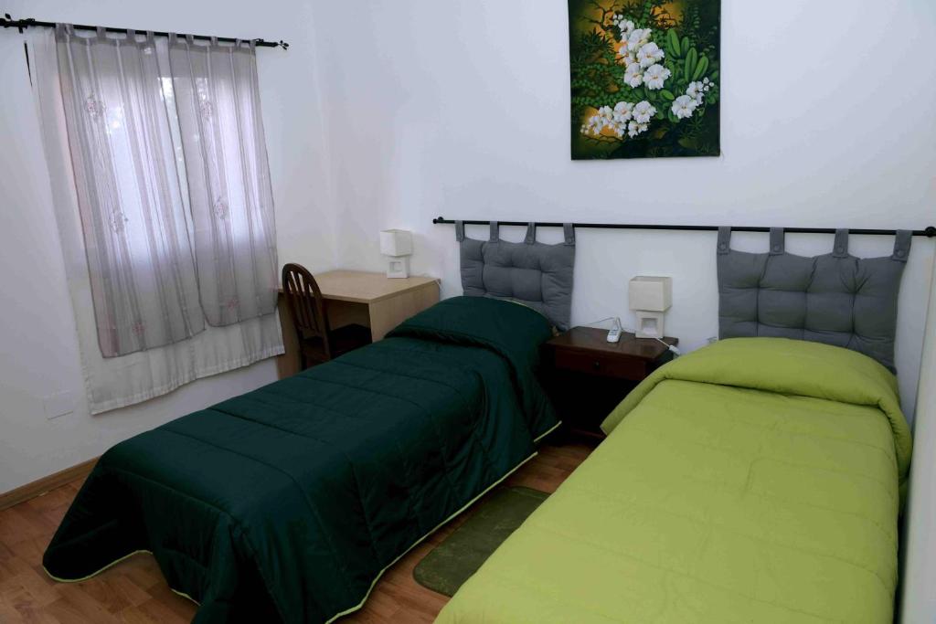 A bed or beds in a room at rita