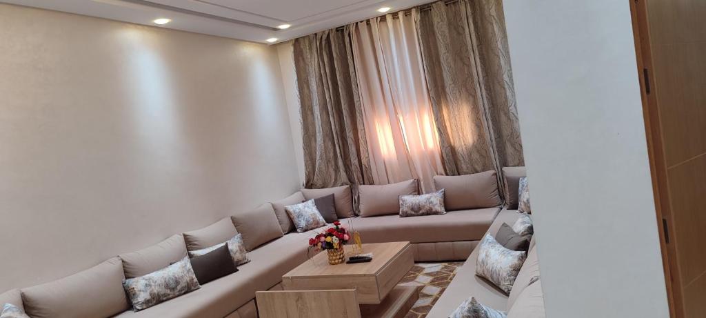 a living room with a couch and a table at تاركة مراكش in Marrakesh