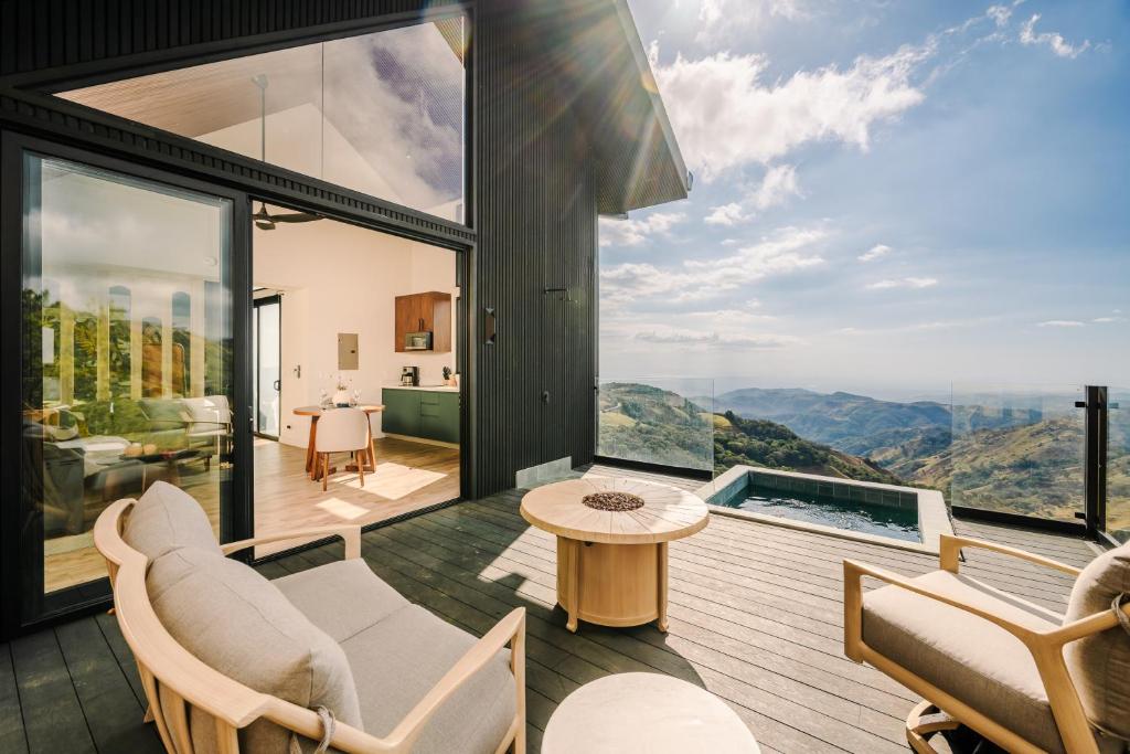 a house with a view of the mountains at Lakay Monteverde with Heated Pool, Golf Cart and Breakfast in Monteverde Costa Rica