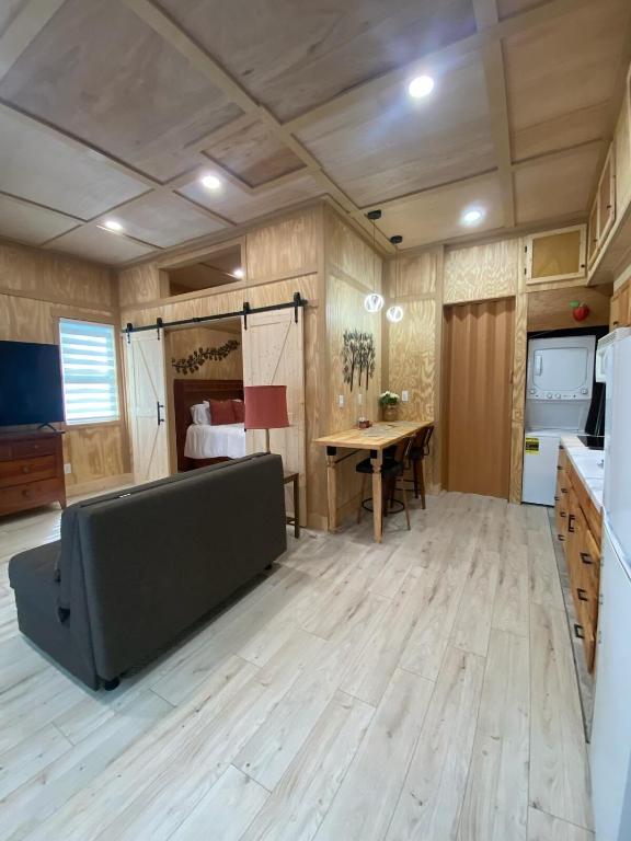 a large room with a table and a bed at Tiny Home in Lawrenceville in Lawrenceville