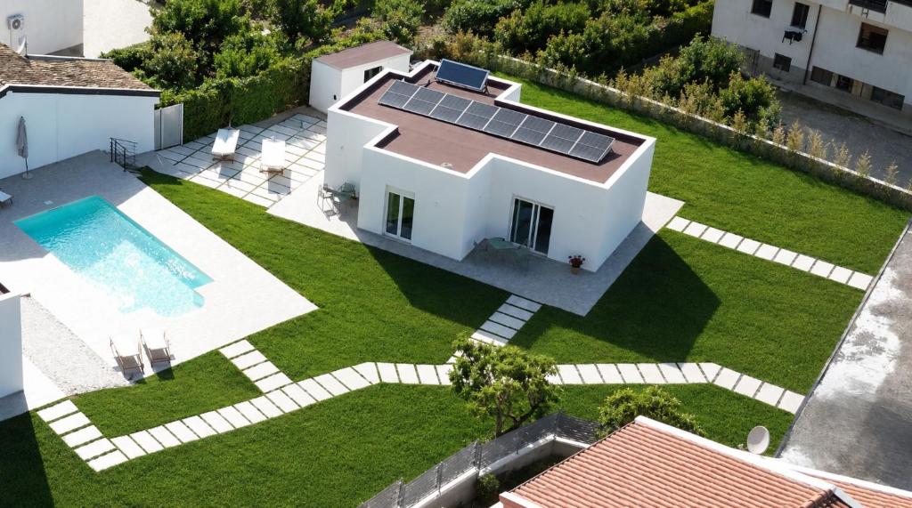 an image of a house with solar panels on the yard at SottoSopra Tropea in Tropea