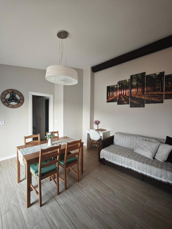 a living room with a table and a couch at Can Costals Cerezo in Pals