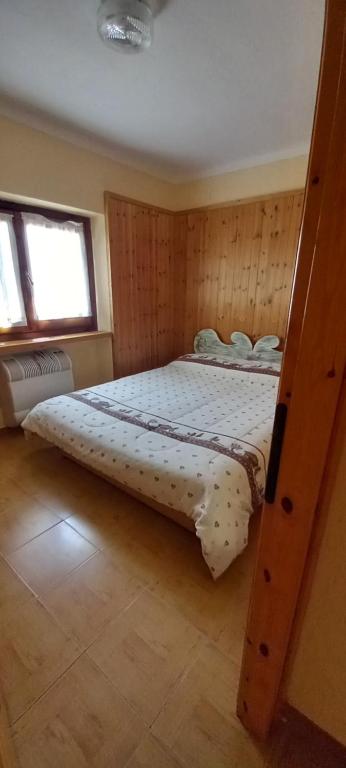 a bedroom with a large bed in a room at La gerbe d'or in Saint Nicolas