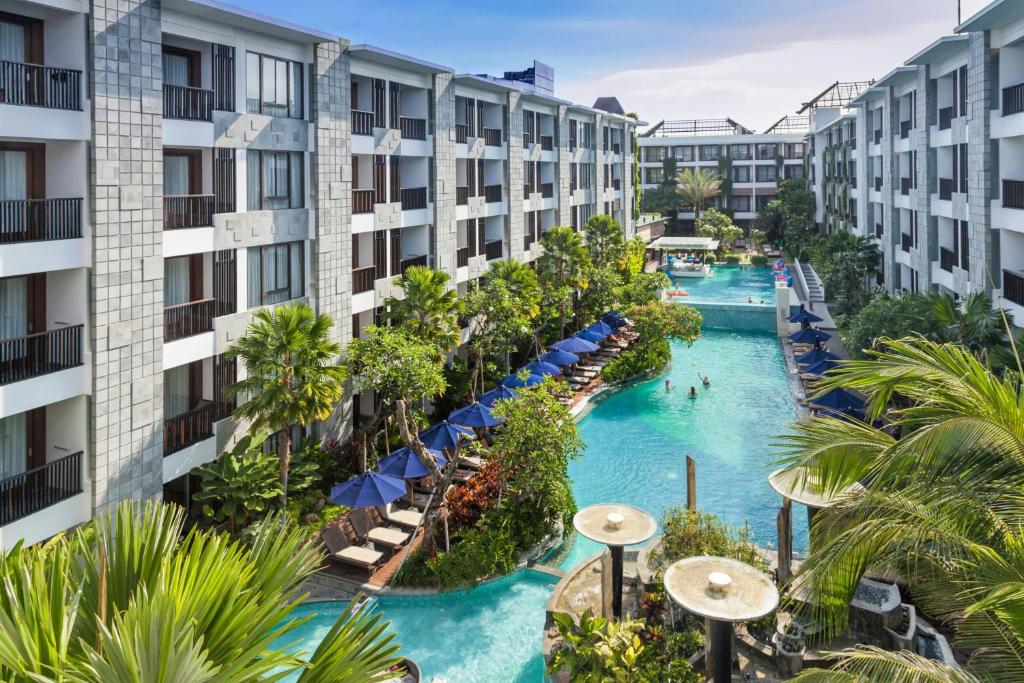 an aerial view of the pool at the resort at Courtyard by Marriott Bali Seminyak Resort in Seminyak