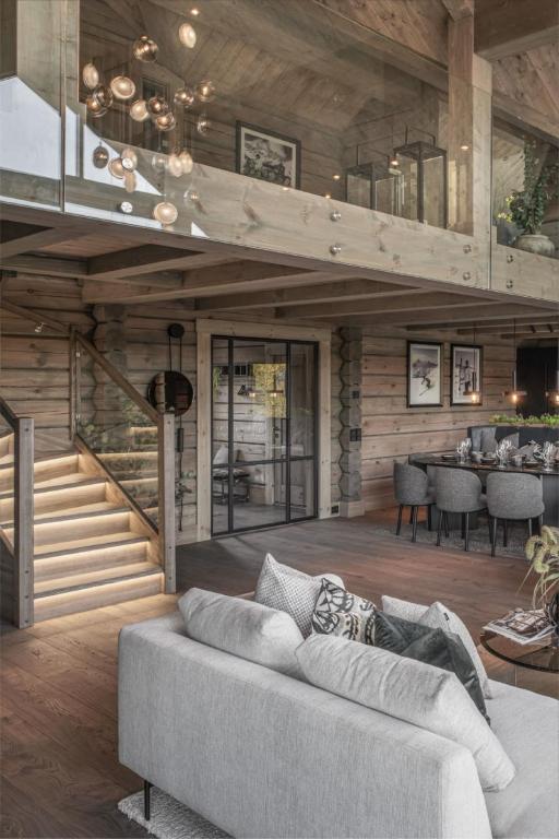 a living room with a couch and a staircase at mm1d in Mavrovo