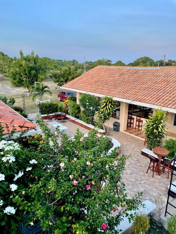 an overhead view of a garden with flowers and a building at The Mountainstream Lodge in Lethem