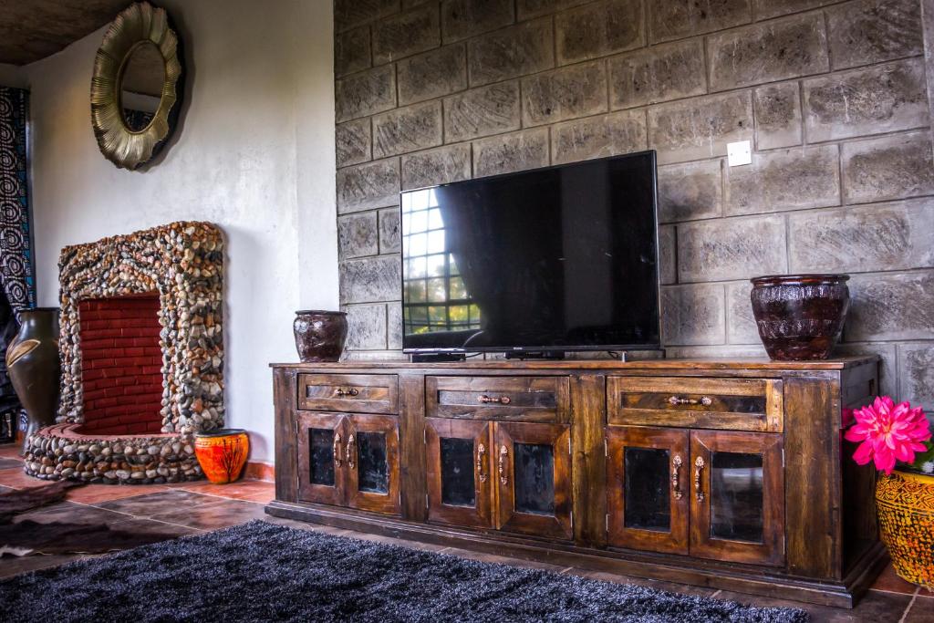 TV a/nebo společenská místnost v ubytování Runda Lofts