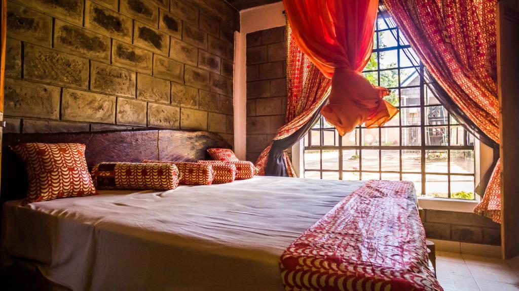 Postel nebo postele na pokoji v ubytování Runda Lofts