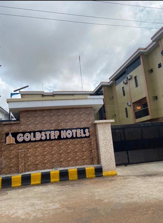 a building with a sign that reads goldier hotels at Goldstep Hotel Asaba in Asaba