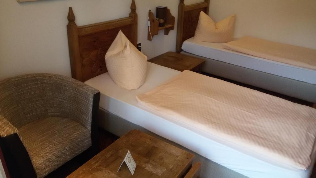 Postel nebo postele na pokoji v ubytování Solitaire Hotel
