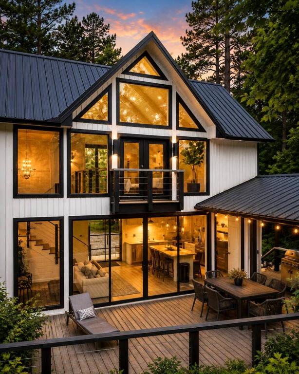 a large house with a lot of windows at Fall Hideaway - VailsBluff - Romantic Escape in Broken Bow
