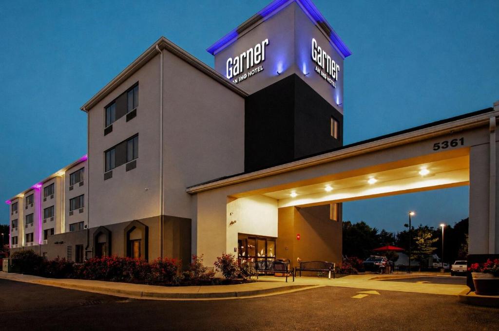 a hotel with a sign on top of a building at Garner Hotel Frederick Southeast by IHG in Frederick