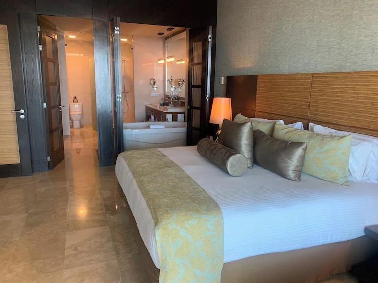 a large bedroom with a large bed and a bathroom at Vidanta in Nuevo Nayarit