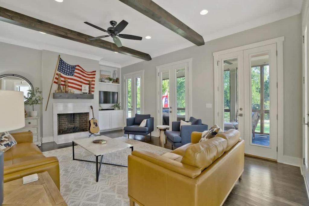 a living room with a couch and a fireplace at Musician's Ranch in Franklin