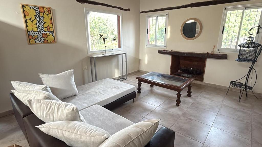 a living room with a couch and a table at Aurora - calle Del Sol in Santa Rosa
