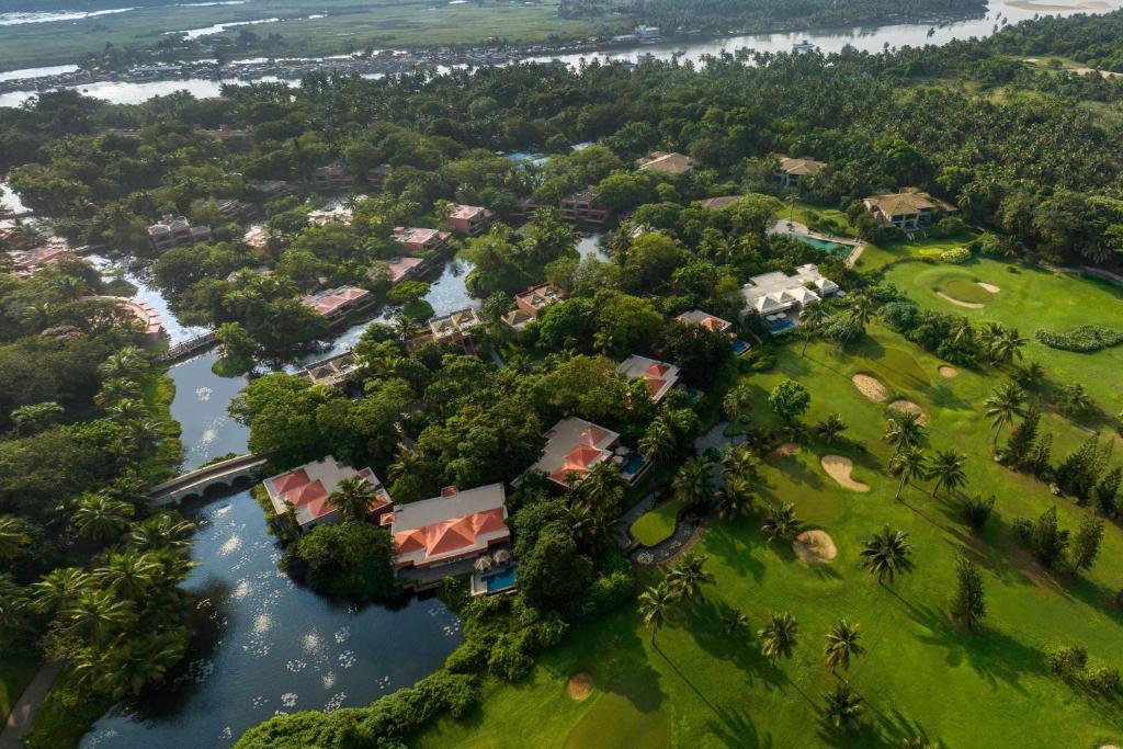 an aerial view of a resort on a river at The St. Regis Goa Resort in Cavelossim