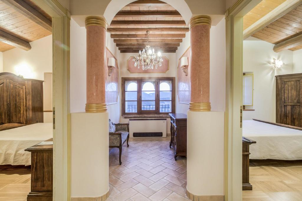Postel nebo postele na pokoji v ubytování La Castellaia Resort