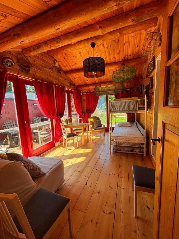a living room with a couch and a table at Tranan' in Karlsborg