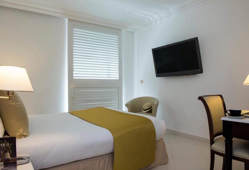 TV a/nebo společenská místnost v ubytování Hotel Aston La Scala