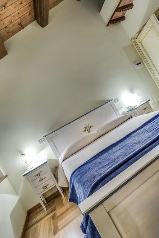 Postel nebo postele na pokoji v ubytování La Castellaia Resort