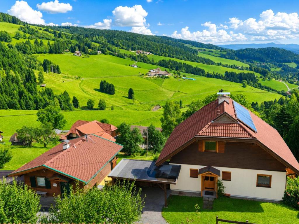 a house in the middle of a green valley at Landhaus zur Sonne in Diex
