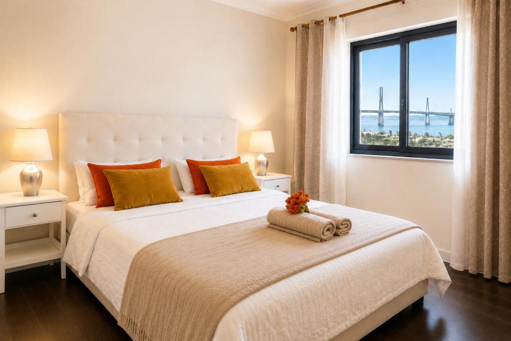 a white bedroom with a large bed with a window at Bom dia Parque Nações Lisboa W in Lisbon