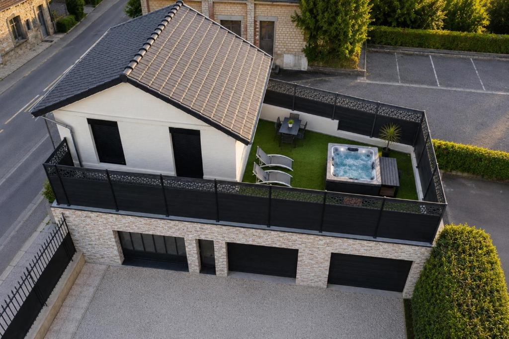 an aerial view of a house with a roof at La Maison du faubourg & Spa in Vitry-le-François
