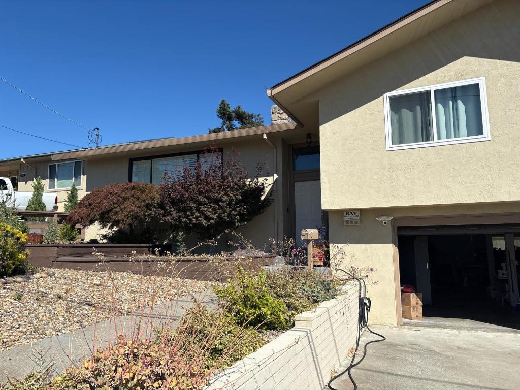 a house with a driveway and a garage at 907 elm in Rodeo