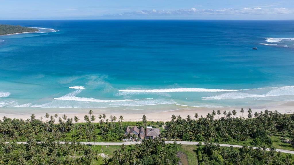an aerial view of a beach and the ocean at Marbella Mentawai Beachfront Private Villa Sleeps 10 in Katiet