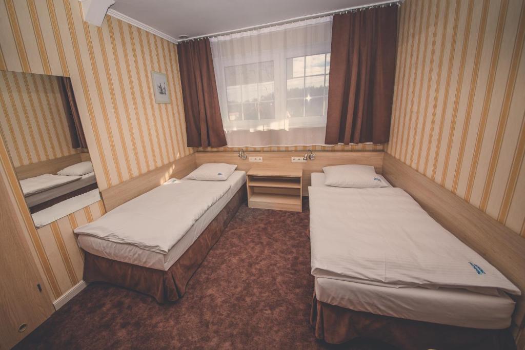 Postel nebo postele na pokoji v ubytování Pokoje gościnne Truskawkowa 1a
